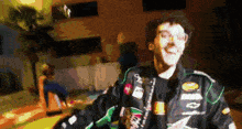 a man wearing a jacket with chevrolet written on it