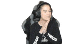a woman wearing headphones and a shirt that says rogue on it