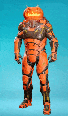 a robot with a pumpkin head is standing on a blue surface .