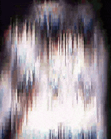 a blurry picture of a waterfall in the dark