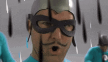 a man with a mustache wearing a mask and a silver helmet