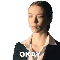 a woman in a suit says okay in front of her face