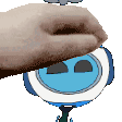 a close up of a person 's hand holding a cartoon character 's face .