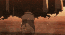 a person is standing in the middle of a desert with a huge explosion coming out of it .