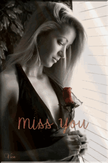 a picture of a woman holding a rose with the words " miss you " written on the bottom