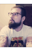 a man with a beard is wearing a shirt that says star trek