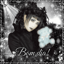 a black and white photo of a woman holding a teddy bear with the words bom dia written below her