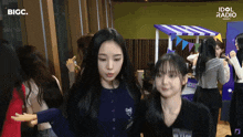 a group of girls are standing in a room with the words idol radio on the bottom