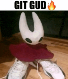 a picture of a stuffed animal with the words git gud written above it
