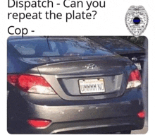 a gray car with a california license plate that says ummm no