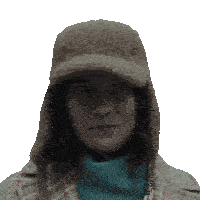 a woman wearing a hat and a plaid coat