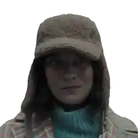 a woman wearing a hat and a plaid coat