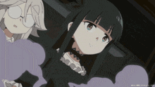 a girl with long black hair stands next to another girl