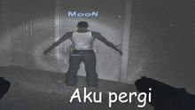 a man in a white tank top stands in front of a wall with the name moon on it