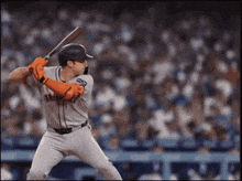 a baseball player wearing a giants jersey is about to swing his bat