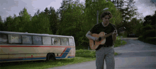 Playing Acoustic Guitar Boy In Space GIF - Playing Acoustic Guitar Boy In Space Robin Lundbäck GIFs