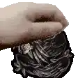 a close up of a person 's hand holding a piece of plastic wrap .