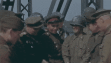 a group of men in military uniforms and helmets are standing in a circle