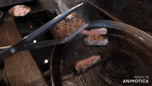 a pair of scissors is cutting a piece of meat in a pan