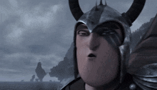 a cartoon character wearing a helmet with horns makes a funny face