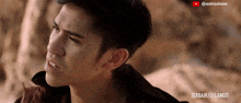 a close up of a man 's face with the words terbaik menjadi langit on the bottom