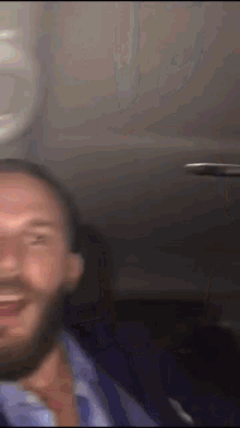 a blurry photo of a man with a beard