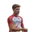 a man wearing a red and white cofidis jersey eating popcorn