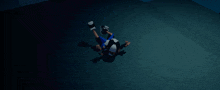 a cartoon character is laying on the floor with a blue hat on