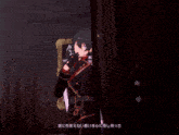 a couple of anime characters kissing each other with chinese writing on the bottom right