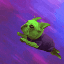 a green dog in a purple shirt is flying in the air