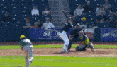 a baseball game being played in front of a first star logistics sign