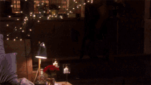 a woman in lingerie is standing in front of a window with lights