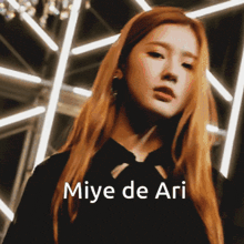 a close up of a woman 's face with the words miye de ari above her