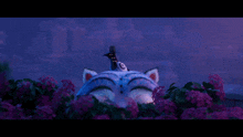 a cartoon cat with a bird on top of it