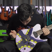 Cleaning Guitar Andrew Baena GIF - Cleaning Guitar Andrew Baena Blowing Dust Off Guitar GIFs
