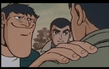 a group of men are standing next to each other and one of them has a big face .