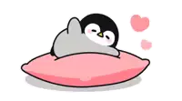 a penguin is laying on a pink pillow with hearts coming out of its eyes .