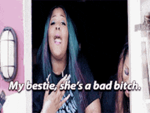 a woman with blue hair is saying my bestie she 's a bad bitch ..