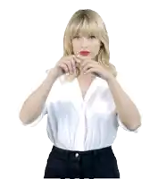 a woman wearing a white shirt and black pants is pointing her fingers up