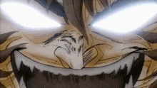 a close up of a cartoon character 's face with glowing eyes and teeth .