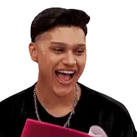 a man wearing a chain around his neck is laughing with his mouth open