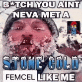 a man with ice on his face is wearing a hat and a mask .