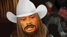 a man with long hair and a beard wearing a white cowboy hat with jib jab written on the bottom