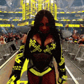 a woman in a caution tape outfit stands in front of a crowd of people