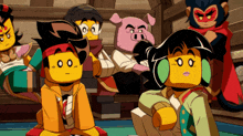 a group of lego characters are sitting in a room
