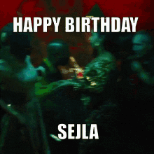 a happy birthday sign with a blurry image of people