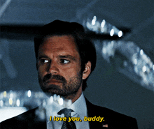a man in a suit says " i love you buddy "