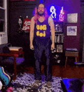 a man wearing a tank top that says big boi on it