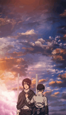 a man and a woman are standing next to each other with a cloudy sky in the background