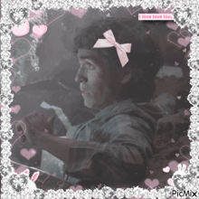 a picture of a boy with a pink bow and the words i love love love on the bottom